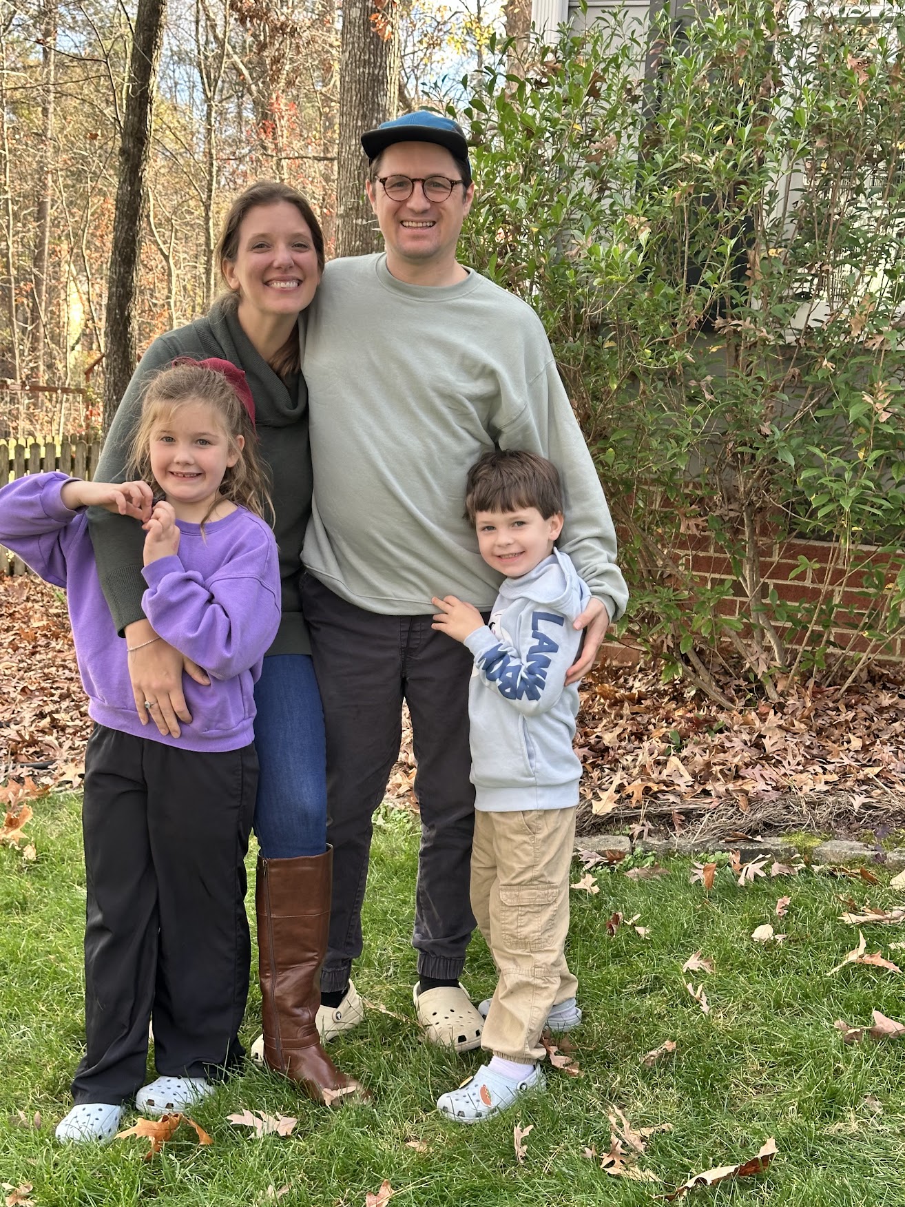 William with his wife and two kids in their backyard