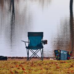 Camp chair by a lake
