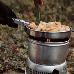 Camp food cooking in a Trangia stove system