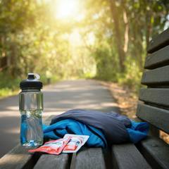 Electrolyte packets and water bottle on a bench