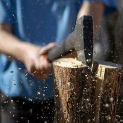 Splitting firewood with a hatchet