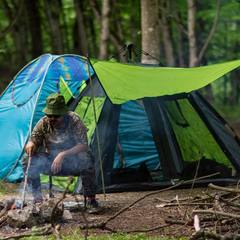 Sleeping bags and pads laid out inside a tent
