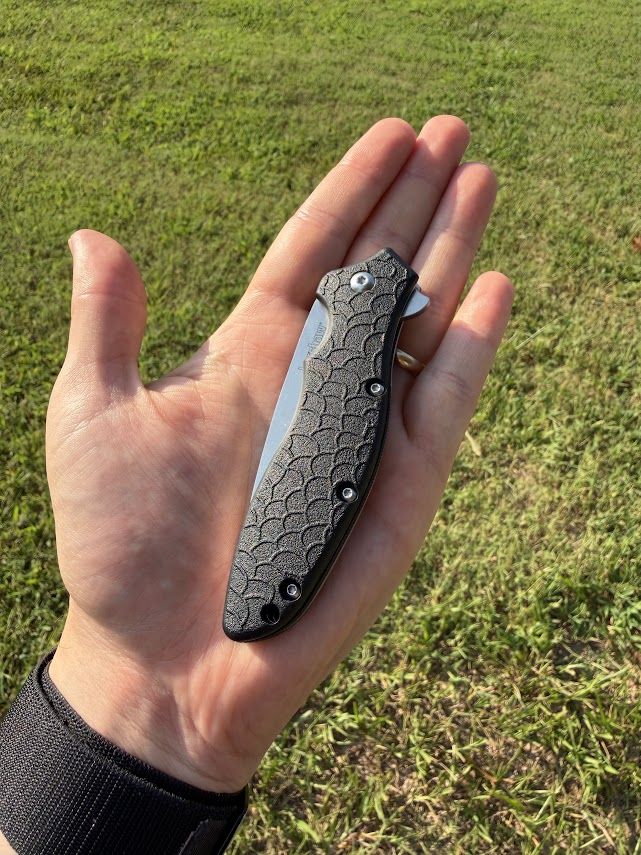 Kershaw Oso Sweet closed, resting in an open palm for scale